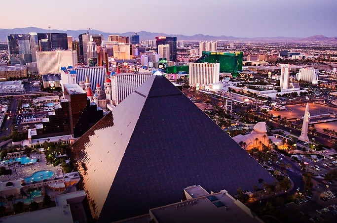 Young girl sitting in Mandalay Bay Hotel room with view of Luxor Hotel and Las  Vegas City Scape in the background Stock Photo - Alamy